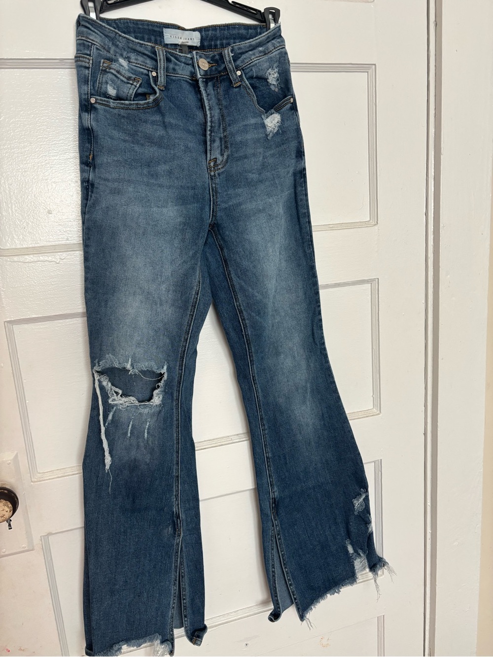 High-Rise Distressed Blue Flare Risen Jeans with Raw Split Hem